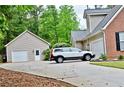 Long driveway leads to a detached garage, providing ample parking space at 125 Murphy Creek Ln, Fayetteville, GA 30215