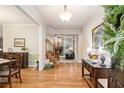 Inviting foyer featuring hardwood flooring, neutral walls, with a view of the living room and fireplace at 1495 Old Hunters Lake Dr, Marietta, GA 30062