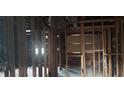 Interior view showing exposed framing, duct work, and missing drywall at 868 Oakhill Sw Ave, Atlanta, GA 30310