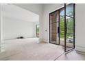 A view of the foyer with a black-trimmed glass door leading to the outside at 1145 Kingston Drive, Atlanta, GA 30342