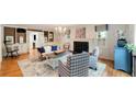 Elegant living room with hardwood floors, fireplace, built-in bookshelves, and ample seating at 1434 Churchill Way, Marietta, GA 30062