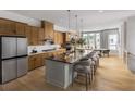 Modern kitchen with a large center island, stainless steel appliances, and an adjacent dining area at 1432 Wicker Wood Se Pl # 9, Smyrna, GA 30080
