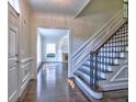 Elegant foyer features hardwood floors, a staircase, and views into the formal living room at 2308 Littlebrooke Dr, Dunwoody, GA 30338