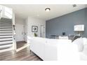 Bright living room features a white sofa, wood floors, and modern decor at 341 Skylar Se Way, Atlanta, GA 30315
