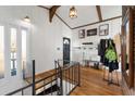 Bright foyer with wooden floors, white walls, and stairs with iron railing at 405 Miller Rd, Covington, GA 30014