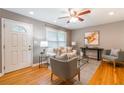 Bright living room with hardwood floors, neutral decor, and a large window providing ample natural light at 1145 Arbordale Dr, Decatur, GA 30033