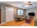 Inviting living room with hardwood floors, large windows, and comfortable seating at 1145 Arbordale Dr, Decatur, GA 30033
