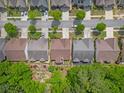 An overhead shot of the home, showing proximity to neighborhood streets and landscaping at 1867 Willoughby Dr, Buford, GA 30519