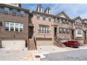 Attractive brick townhome with a garage and steps, blending classic charm and practicality in a sought-after location at 2122 Pembroke Dr, Brookhaven, GA 30319