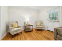 Cozy living room features hardwood floors and two comfortable armchairs with decorative pillows at 2381 Woodacres Ne Rd, Atlanta, GA 30345