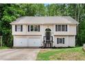Charming two-story home featuring a two-car garage and welcoming front porch at 5174 Ridge Tarn, Acworth, GA 30102