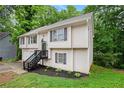Charming two-story home featuring a two-car garage and welcoming front porch at 5174 Ridge Tarn, Acworth, GA 30102