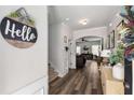 Bright entryway with stylish decor and a view of the living area, featuring hardwood flooring at 3406 Pennington Dr, Lithonia, GA 30038