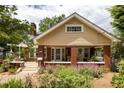 Traditional-style home featuring a welcoming front porch and meticulously maintained landscaping at 492 Clifton Ne Rd, Atlanta, GA 30307