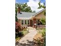 Home with brick accents, inviting front porch, and pathway surrounded by lovely landscaping at 492 Clifton Ne Rd, Atlanta, GA 30307