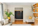 Bright living area with hardwood floors, comfortable seating, and a convenient mudroom nook at 1652 Oak Grove Rd, Decatur, GA 30033