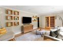 Stylish living room with modern entertainment center and decor with comfortable seating and natural light at 1652 Oak Grove Rd, Decatur, GA 30033