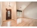Bright foyer with wood floors, a soaring ceiling, and a decorative front door at 12 Westchester Square Sq, Decatur, GA 30030