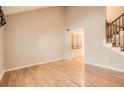Spacious living room with wood floors, staircase, and built-in shelving at 12 Westchester Square Sq, Decatur, GA 30030