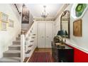 Inviting entryway with hardwood floors, staircase, and decorative accents at 1534 September Chase, Decatur, GA 30033