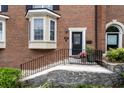 Charming brick home featuring a bay window, arched entryway, and well-maintained landscaping at 1634 Ponce De Leon Ave # 107, Atlanta, GA 30307