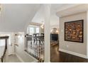 Bright hallway featuring hardwood floors, elegant trim, and views into the dining room at 1634 Ponce De Leon Ave # 107, Atlanta, GA 30307