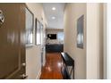 Inviting hallway leading to a bright living area with hardwood floors and stylish decor at 1195 Milton Ter # 1304, Atlanta, GA 30315