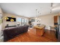 Open-concept living space with a modern kitchen, leather seating, and balcony access at 1195 Milton Ter # 1304, Atlanta, GA 30315