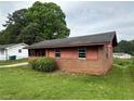 Cozy single-story home with a brick facade and small yard at 4009 Ester Sw Dr, Atlanta, GA 30331