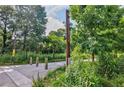 Trailhead entrance to the Atlanta BeltLine is shaded by mature trees at 59 Stafford Nw St, Atlanta, GA 30314