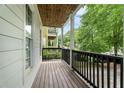 This covered porch has a wood ceiling, painted posts, and wooden railing at 59 Stafford Nw St, Atlanta, GA 30314