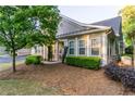Exterior of a home featuring lush landscaping, covered entry, and well-maintained grounds at 2623 Grapevine Cir # 602, Cumming, GA 30041