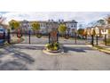 Gated community entrance adorned with holiday wreaths, providing security and festive charm at 5260 Cresslyn Rdg, Alpharetta, GA 30005