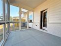 Screened-in back porch with concrete flooring and a view of the private backyard at 1277 Fern Ridge Ct # 22, Norcross, GA 30093