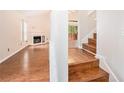 Bright living room featuring hardwood floors, fireplace, and access to the deck at 4795 Wilkins Station Dr, Decatur, GA 30035