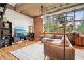 Living room with exposed brick, hardwood floors, and lots of natural light at 640 Glen Iris Ne Dr # 609, Atlanta, GA 30308