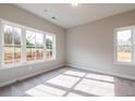 Bright bedroom with neutral carpet and large windows offering ample natural light at 4810 Floydwood Ln, Mableton, GA 30126