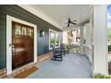 Charming covered front porch with rocking chairs and craftsman details at 2407 Boulder Se Rd, Atlanta, GA 30316