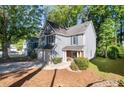 Beautiful two-story home with a two-car garage, manicured landscaping, and a lovely front porch at 3253 Strathmore Dr, Duluth, GA 30096