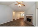 Inviting living area with hardwood floors, a stone fireplace, and natural light at 39 Spring Leaf Pl, Dallas, GA 30157
