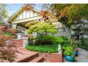 Beautifully landscaped front yard with brick stairs, vibrant plants, and mature trees at 171 Westminster Ne Dr, Atlanta, GA 30309