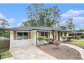 Attractive one-story home displaying a well-manicured lawn, a quaint front entrance and a neatly paved driveway at 2779 Fairlee Dr, Decatur, GA 30032