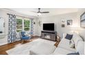 Bright living room boasts a cozy fireplace, stylish furniture, hardwood floors, and a large window at 2779 Fairlee Dr, Decatur, GA 30032