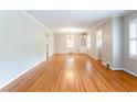 Spacious dining room with hardwood floors, crown molding, and a built-in cabinet at 2227 Leafmore Drive, Decatur, GA 30033