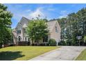 Lovely home with a large lawn, driveway, and attached garage, perfect for suburban living at 1035 Eagles Brooke Dr, Locust Grove, GA 30248