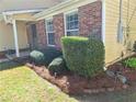 Well-maintained yard with lush greenery and manicured bushes at 3102 Aberdeen Cv, Lithonia, GA 30038