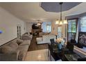 Open concept living room featuring hardwood floors, fireplace, neutral color scheme, and dining area at 345 Oak Springs Nw Dr, Lawrenceville, GA 30043