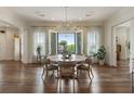 Dining room boasting an abundance of natural light, wood floors, and designer light fixtures at 50 Canton St # 406, Alpharetta, GA 30009
