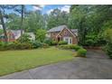 Traditional-style home with a well-manicured lawn and ample green space at 842 Laurel Crest Sw Ct, Marietta, GA 30064