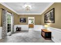 Inviting living room featuring tile floors, large windows, and decorative trim at 842 Laurel Crest Sw Ct, Marietta, GA 30064